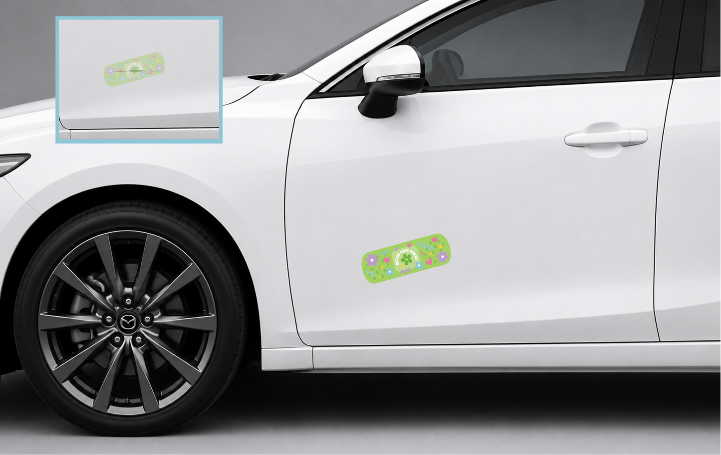 Better Days Ahead bandage-inspired scratch cover decal shown covering a small cosmetic scratch on a white vehicle.